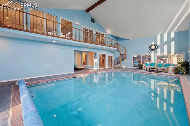 a view of a swimming pool with outdoor seating