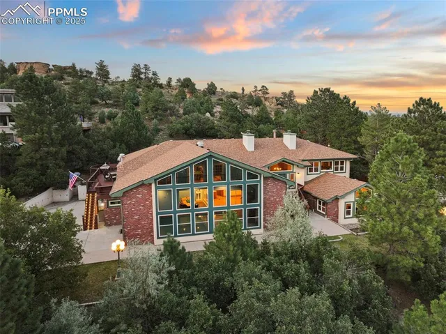 an aerial view of a house with a mountain view