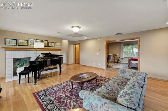 a living room with furniture and a rug