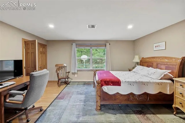 a bedroom with furniture and a window