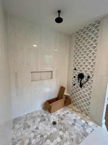 a bedroom with a bed and a shower curtain