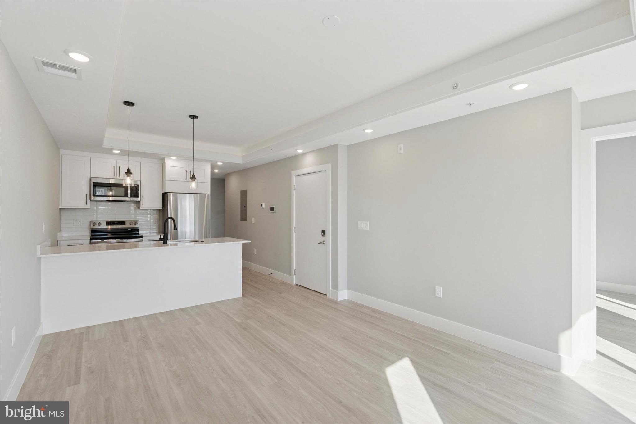 2401 North 2nd Street, Unit F2 Philadelphia, PA 19133 - Photo 2 of 13 a view of kitchen with wooden floor