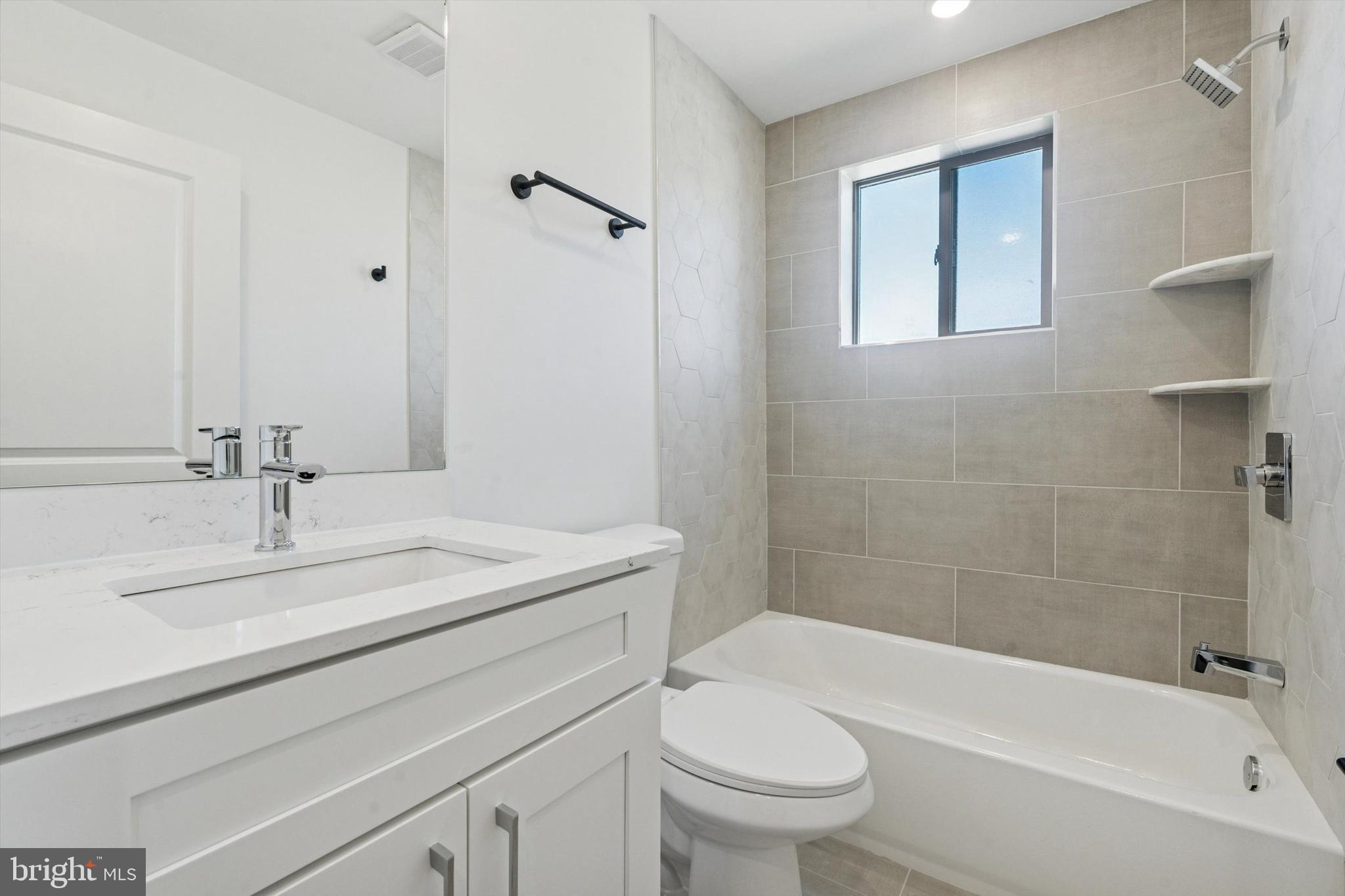 2401 North 2nd Street, Unit F2 Philadelphia, PA 19133 - Photo 7 of 13 a bathroom with a sink toilet and shower