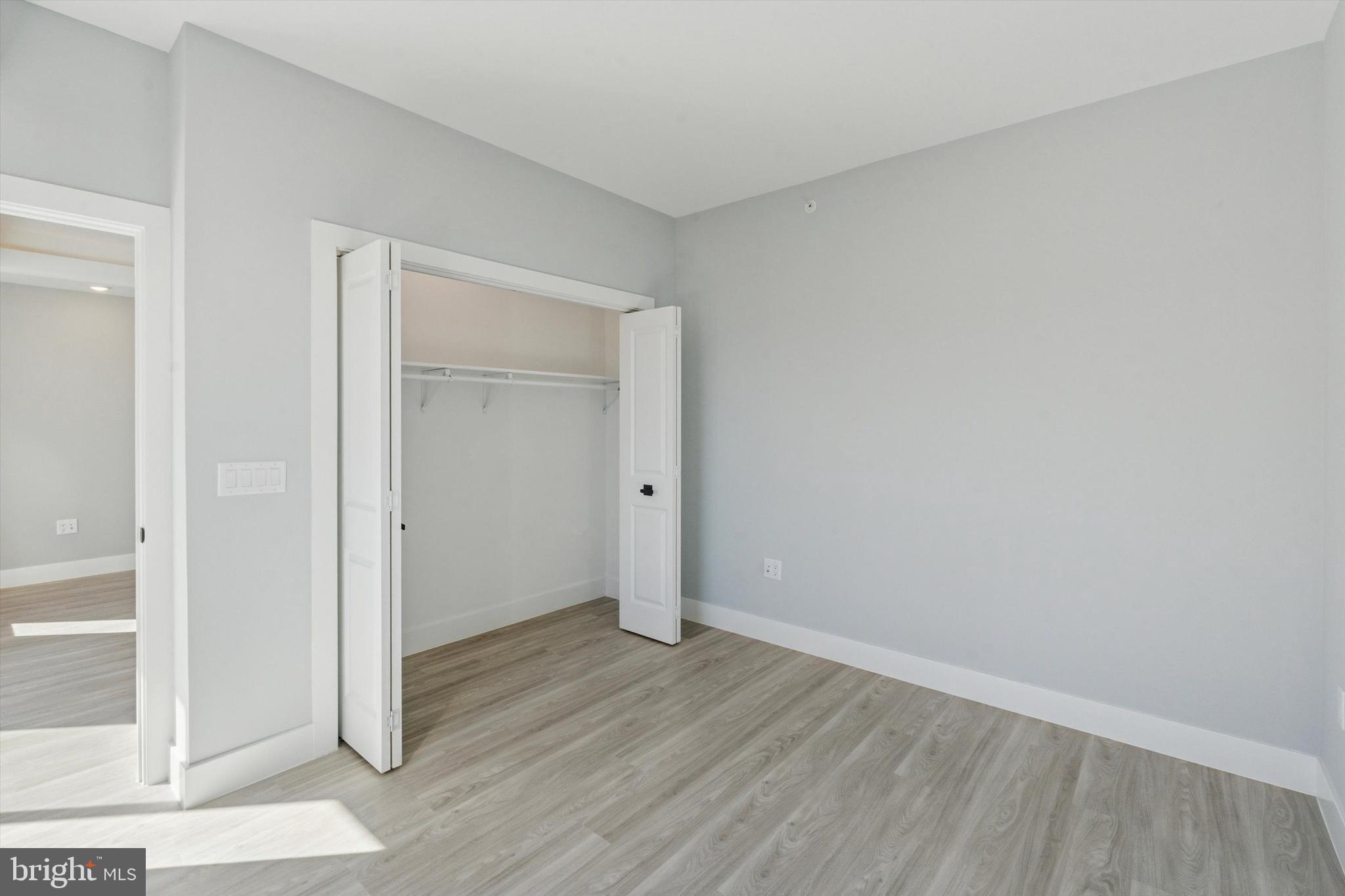 2401 North 2nd Street, Unit F2 Philadelphia, PA 19133 - Photo 8 of 13 wooden floor in an empty room