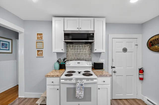a kitchen with a stove and a microwave
