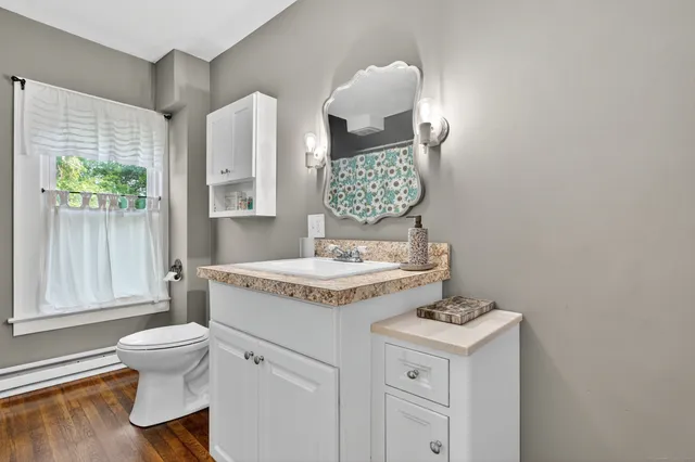 a view of bathroom with a sink and a toilet