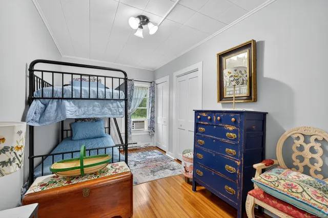 a bedroom with furniture and a fireplace