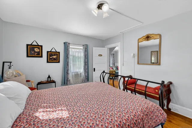 a bedroom with a bed and a table