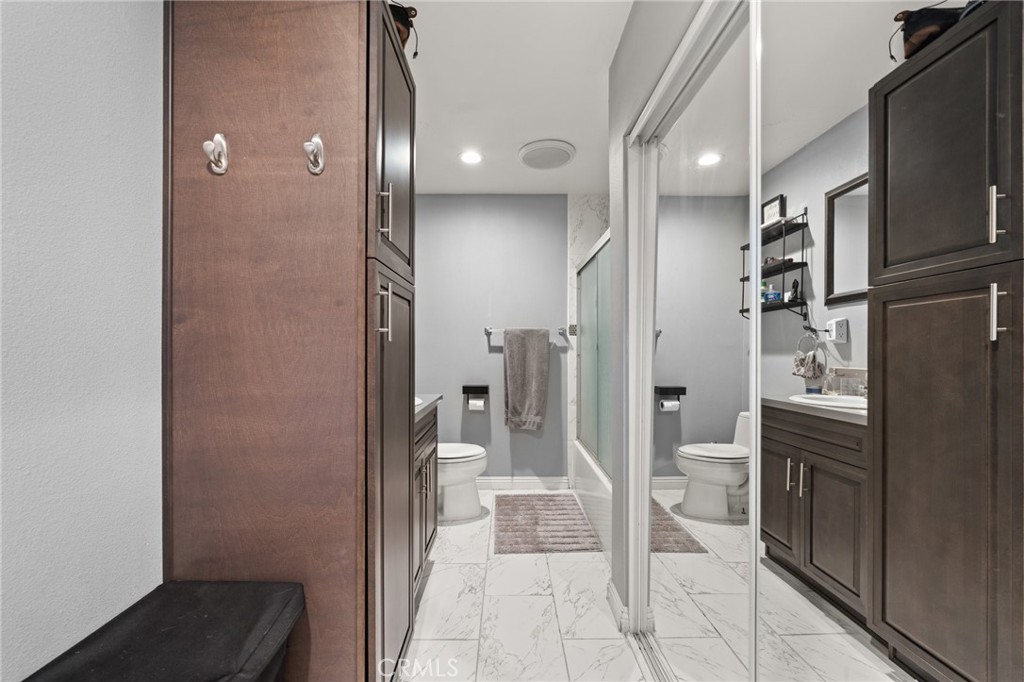 15326 Leffingwell Road Whittier, CA 90604 - Photo 11 of 20 a bathroom with a sink and a mirror