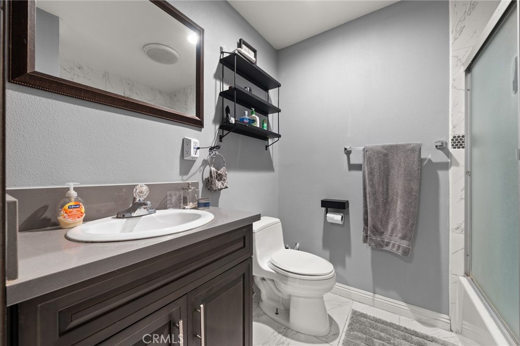 15326 Leffingwell Road Whittier, CA 90604 - Photo 12 of 20 a bathroom with a sink a toilet and shower