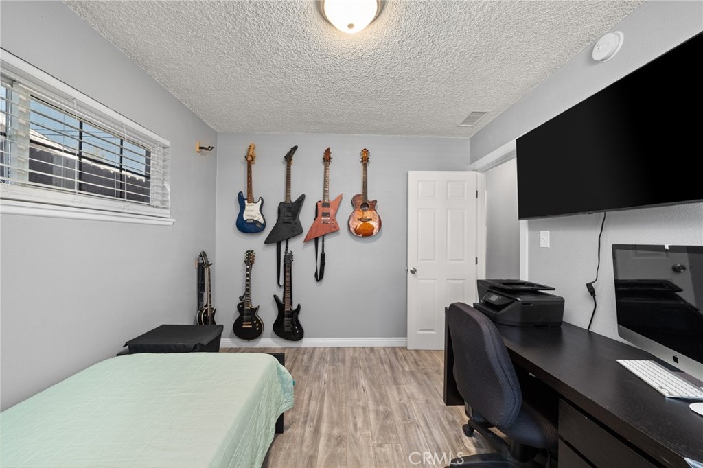 15326 Leffingwell Road Whittier, CA 90604 - Photo 14 of 20 a view of a workspace with furniture and a flat screen tv
