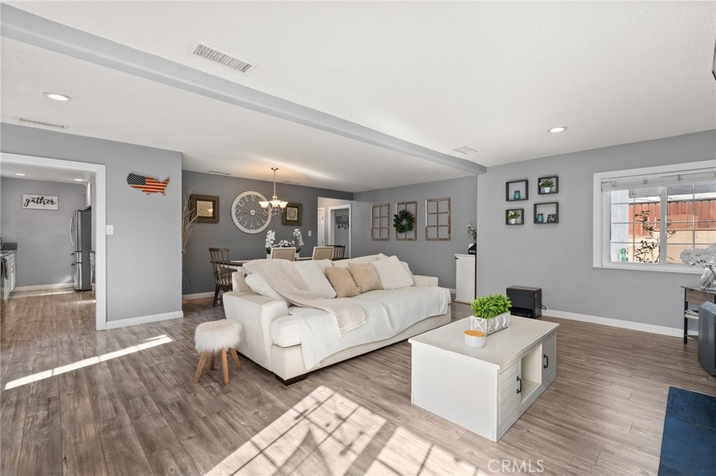 15326 Leffingwell Road Whittier, CA 90604 - Photo 6 of 20 a living room with furniture and wooden floor