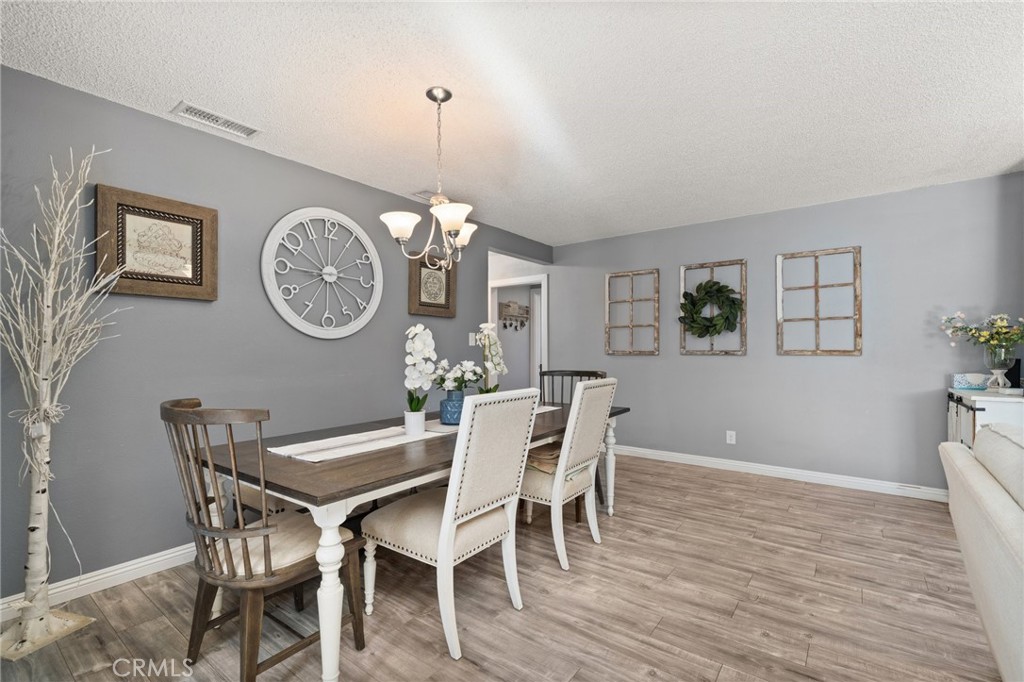 15326 Leffingwell Road Whittier, CA 90604 - Photo 7 of 20 a view of a dining room with furniture window and wooden floor