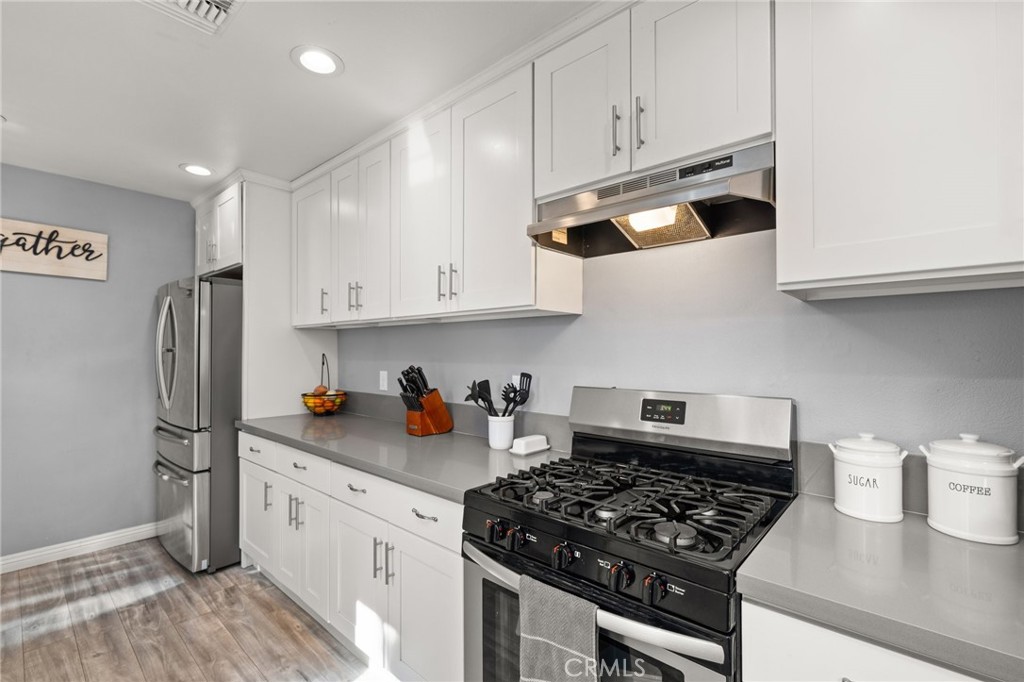 15326 Leffingwell Road Whittier, CA 90604 - Photo 9 of 20 a kitchen with stainless steel appliances granite countertop a sink stove and refrigerator