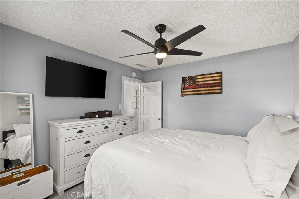 15326 Leffingwell Road Whittier, CA 90604 - Photo 10 of 20 a bedroom with a bed and a flat screen tv