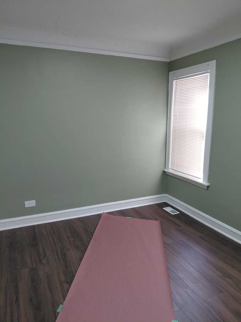 1040 West 92nd Place Chicago, IL 60620 - Photo 12 of 29 a view of a room with wooden floor and window