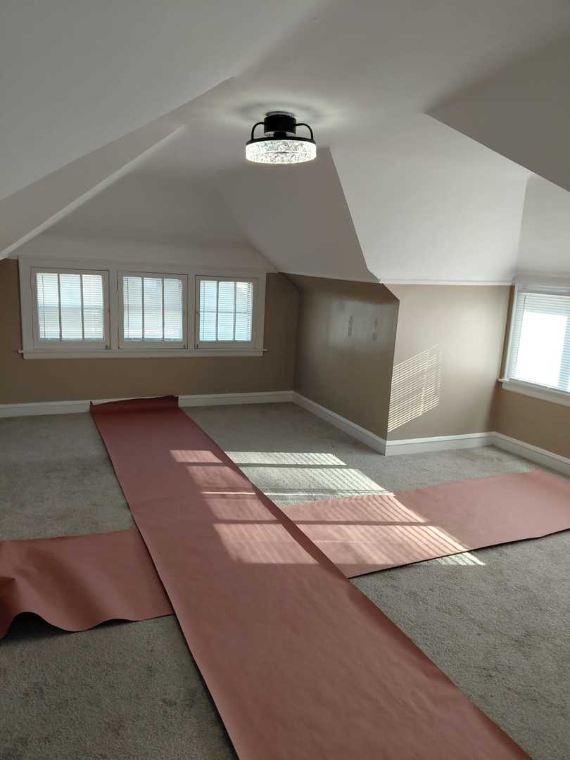 1040 West 92nd Place Chicago, IL 60620 - Photo 20 of 29 a bedroom with a bed and a large mirror