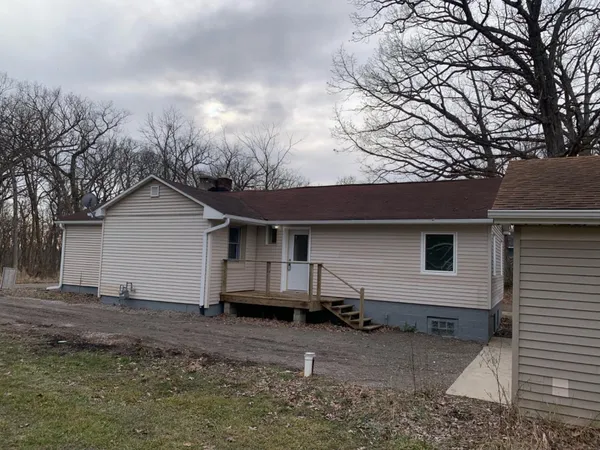 a house view with a backyard space