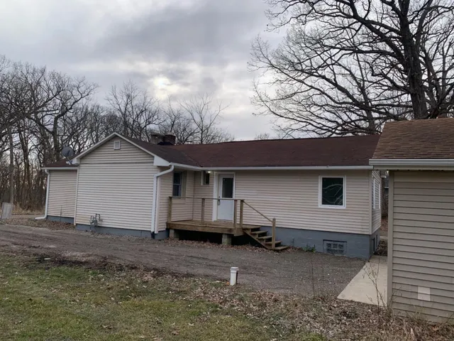 a house view with a backyard space