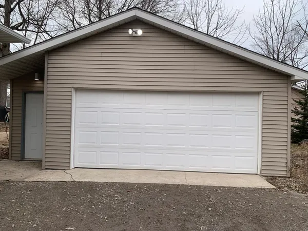 a side view of a house with a yard