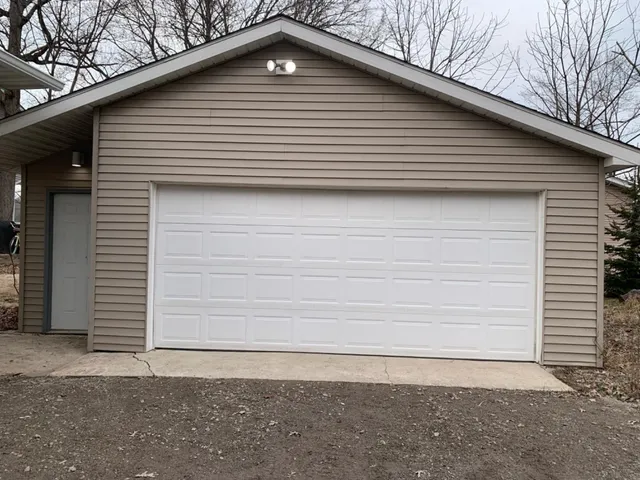 a side view of a house with a yard