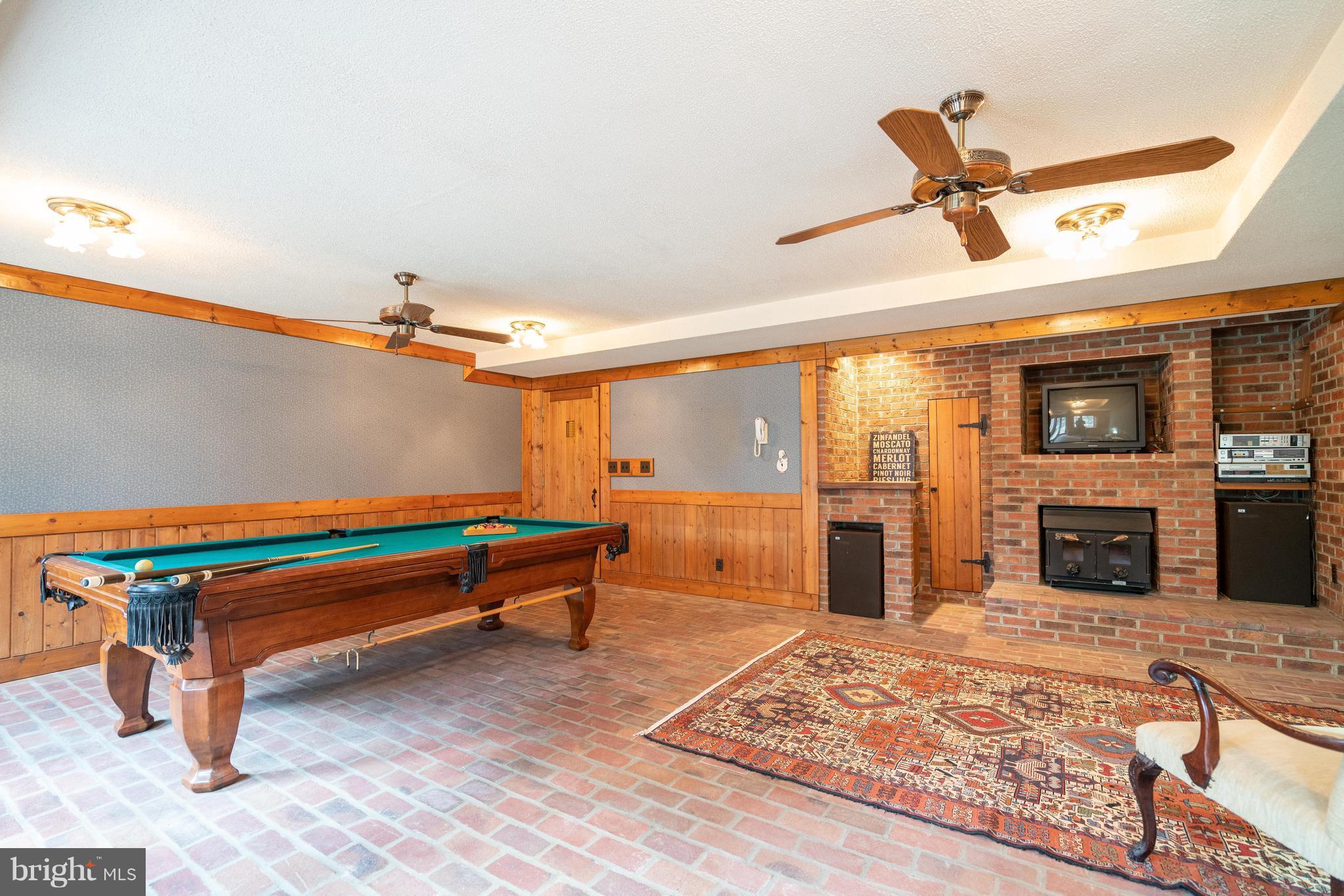 7814 Willowbrook Road Fairfax Station, VA 22039 - Photo 23 of 30 Brick floored lower level Recreation Room