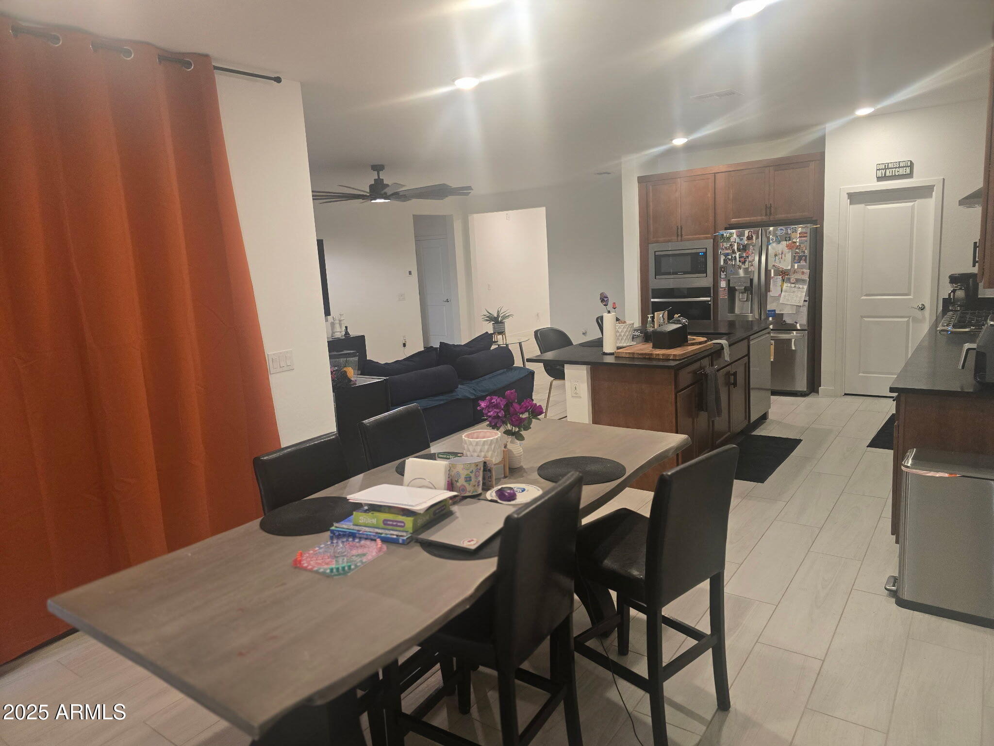 17446 West Fulton Street Goodyear, AZ 85338 - Photo 14 of 16 a dining room with furniture and wooden floor