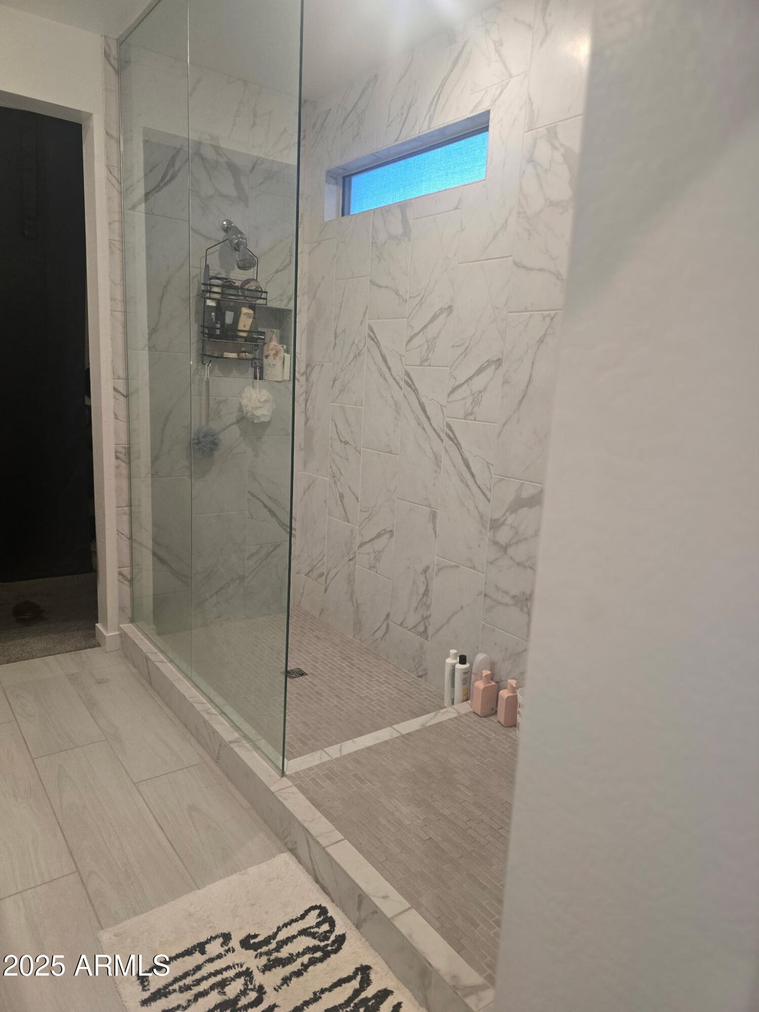 17446 West Fulton Street Goodyear, AZ 85338 - Photo 16 of 16 a bathroom with a shower