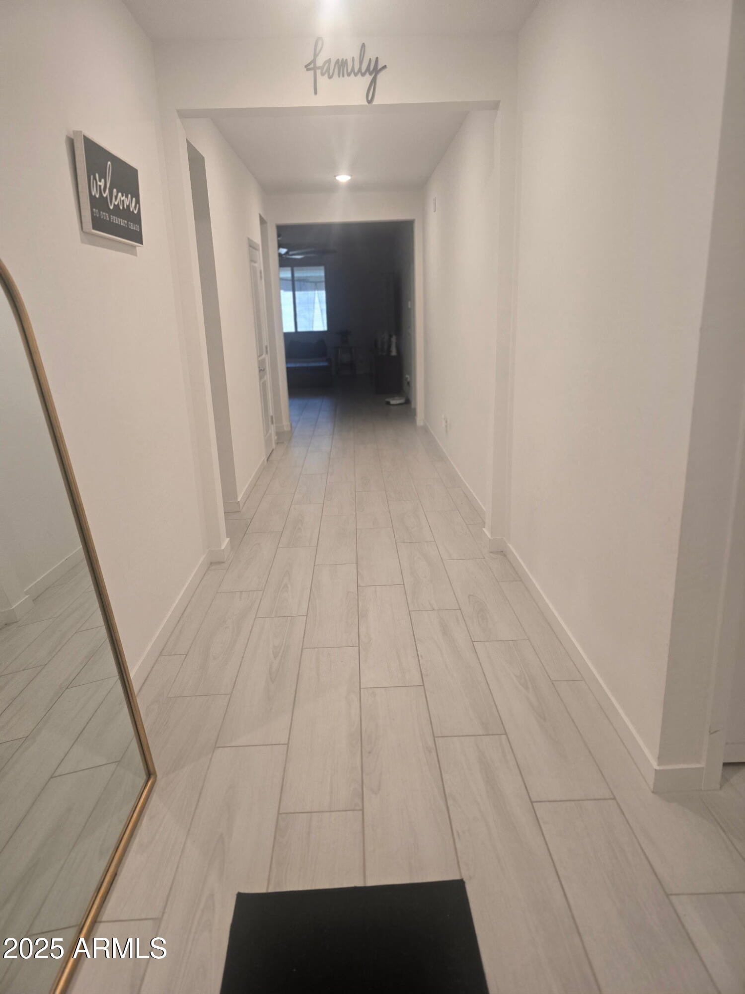 17446 West Fulton Street Goodyear, AZ 85338 - Photo 3 of 16 a view of a hallway