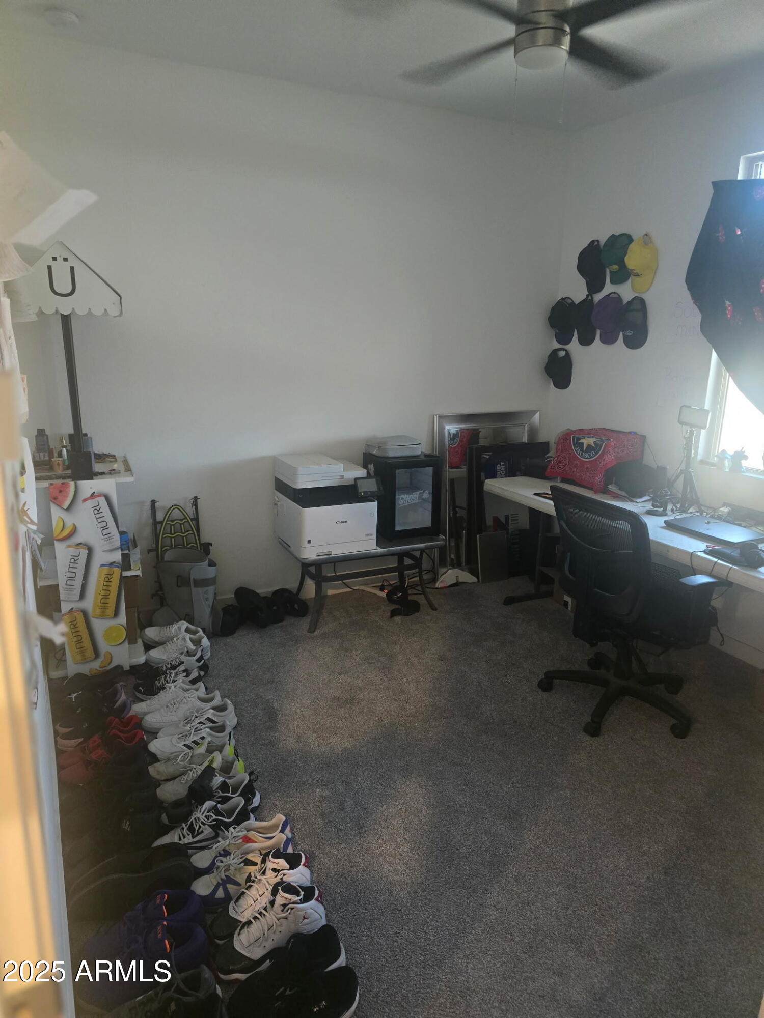 17446 West Fulton Street Goodyear, AZ 85338 - Photo 5 of 16 a room with a wooden floor and shoes