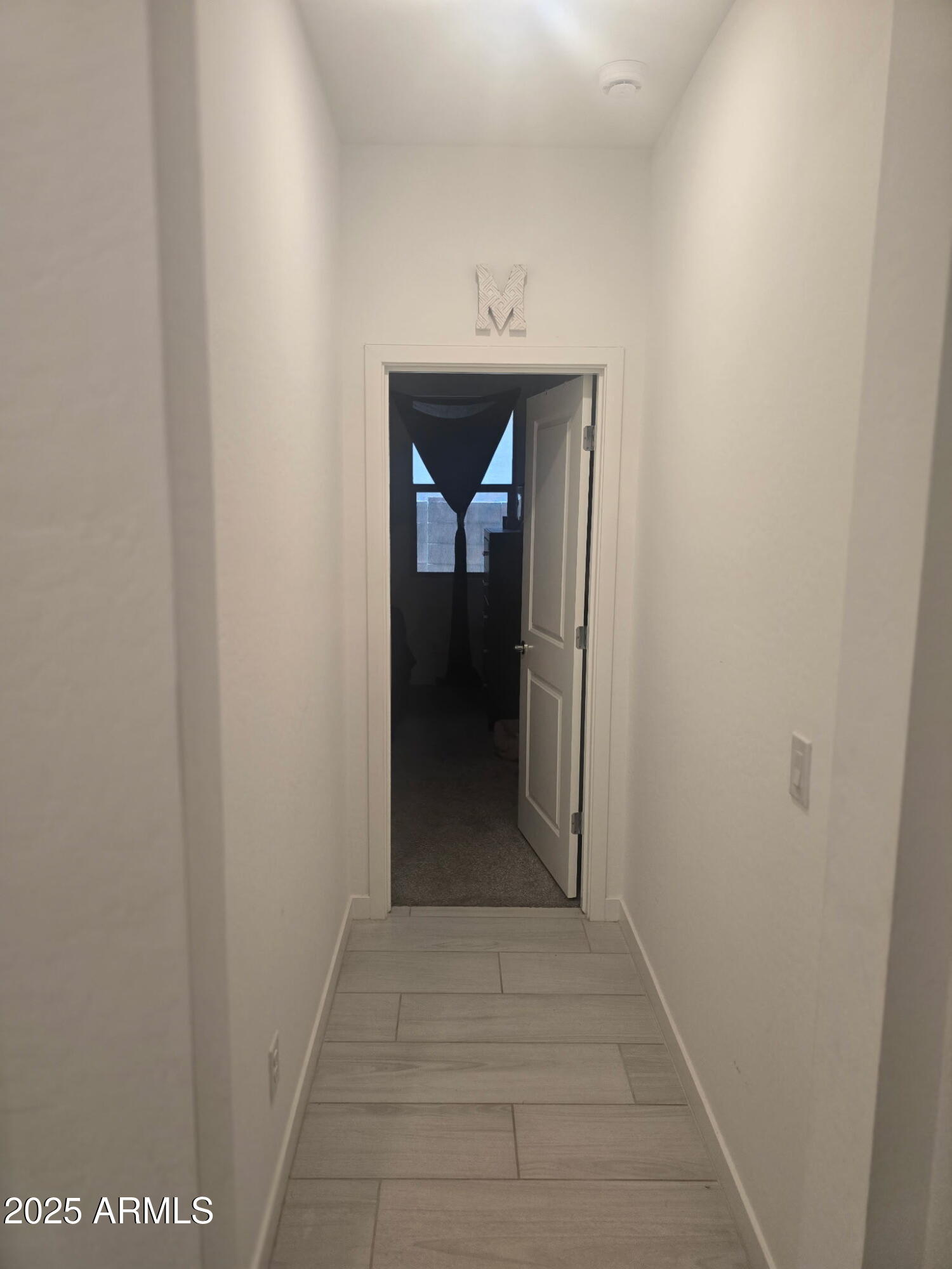 17446 West Fulton Street Goodyear, AZ 85338 - Photo 10 of 16 a view of a hallway to a hallway