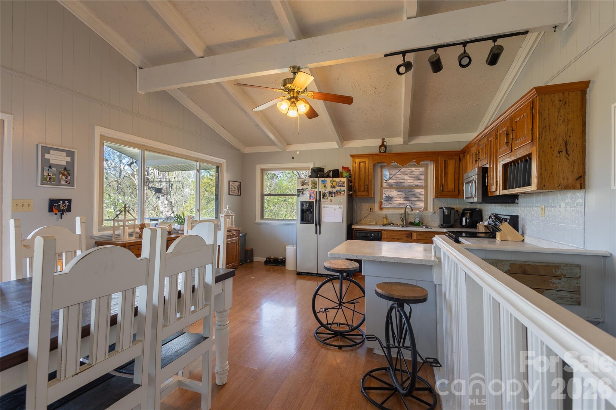 344 Pine Ridge Trail Almond, NC 28702 - Photo 11 of 36 a kitchen that has a lot of cabinets a sink and appliances in it