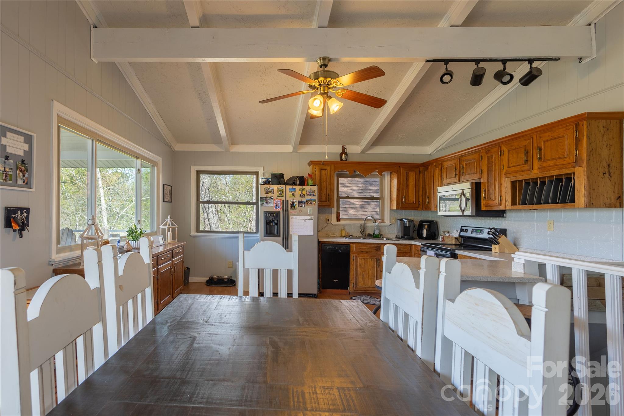 344 Pine Ridge Trail Almond, NC 28702 - Photo 12 of 36 a dining hall with stainless steel appliances granite countertop a stove and a refrigerator