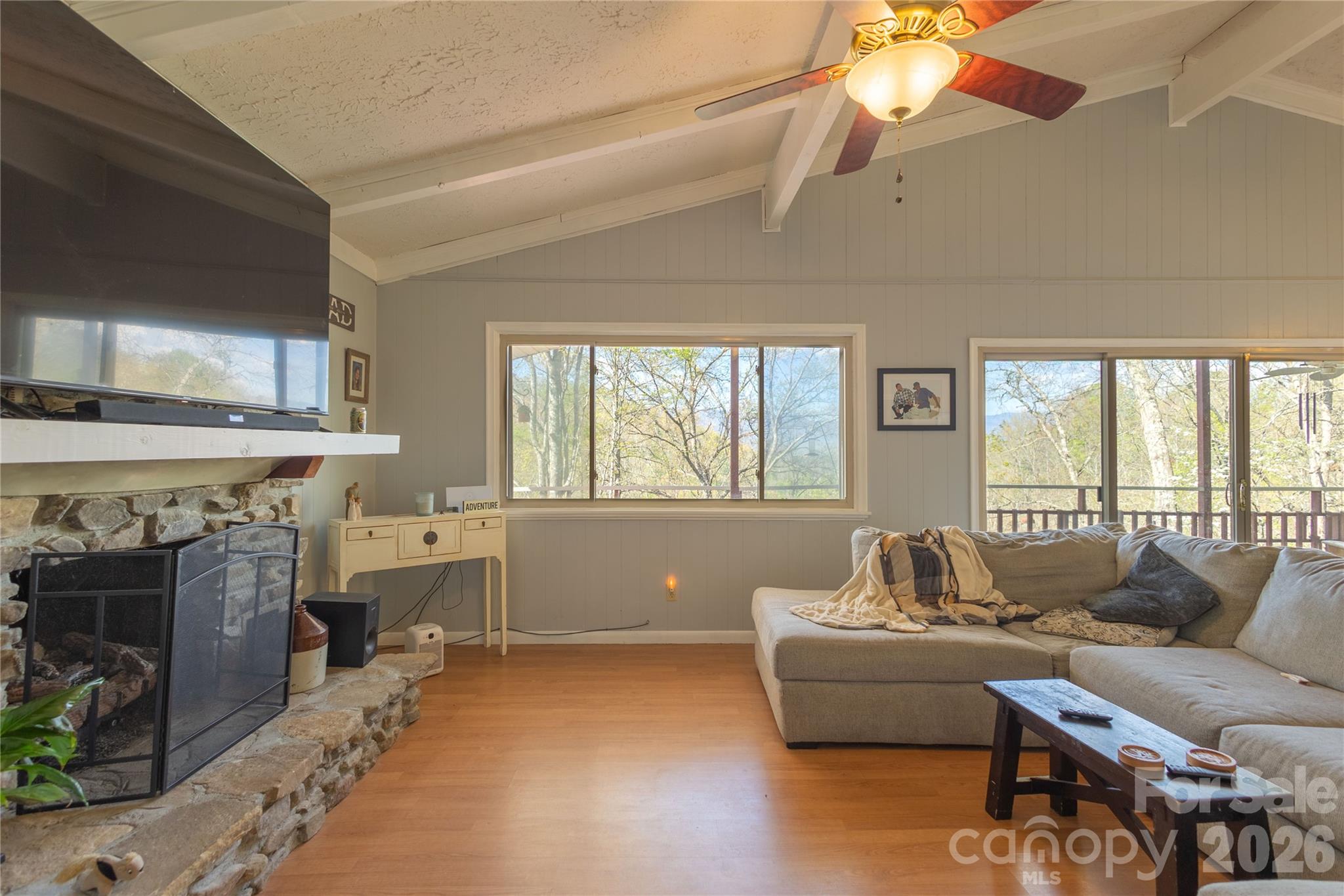 344 Pine Ridge Trail Almond, NC 28702 - Photo 16 of 36 a living room with furniture and a fireplace