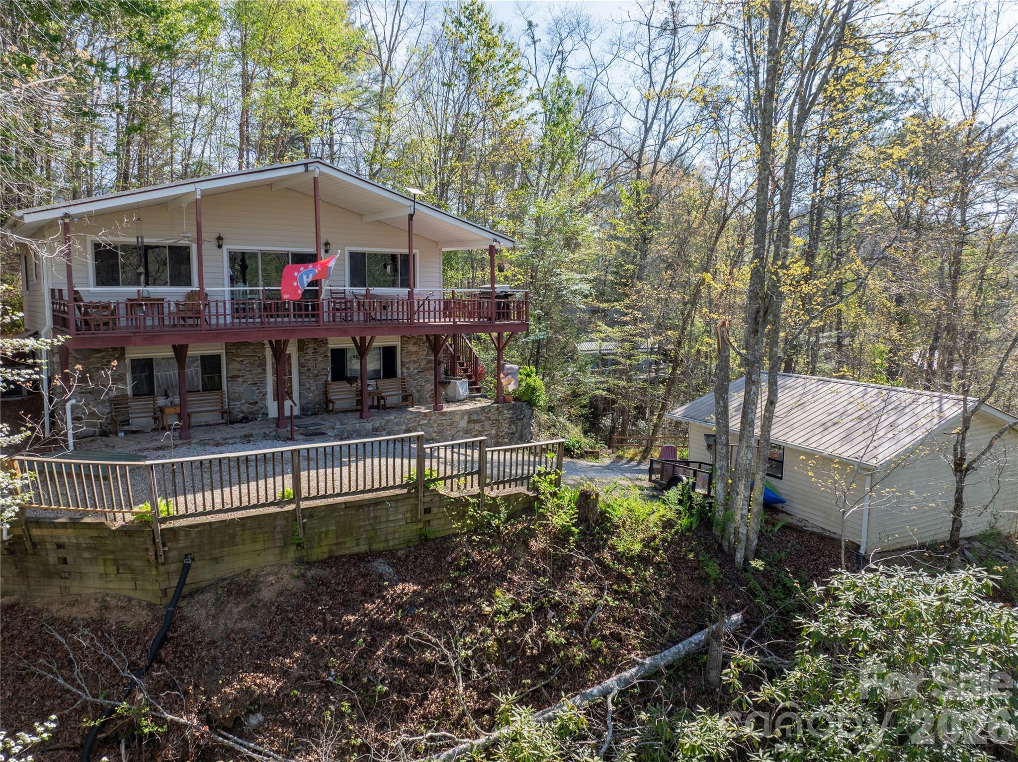 344 Pine Ridge Trail Almond, NC 28702 - Photo 2 of 36 a front view of a house with a yard