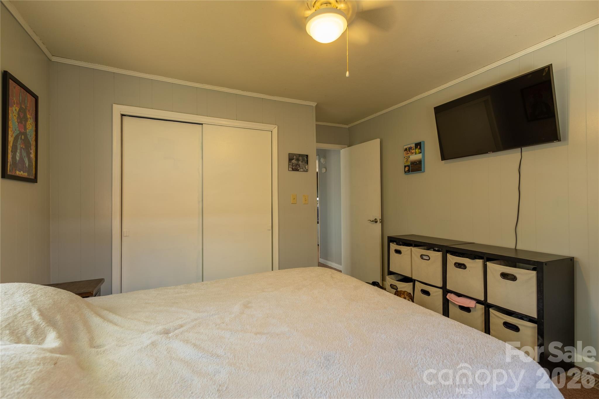 344 Pine Ridge Trail Almond, NC 28702 - Photo 21 of 36 a bedroom with a bed and a flat screen tv