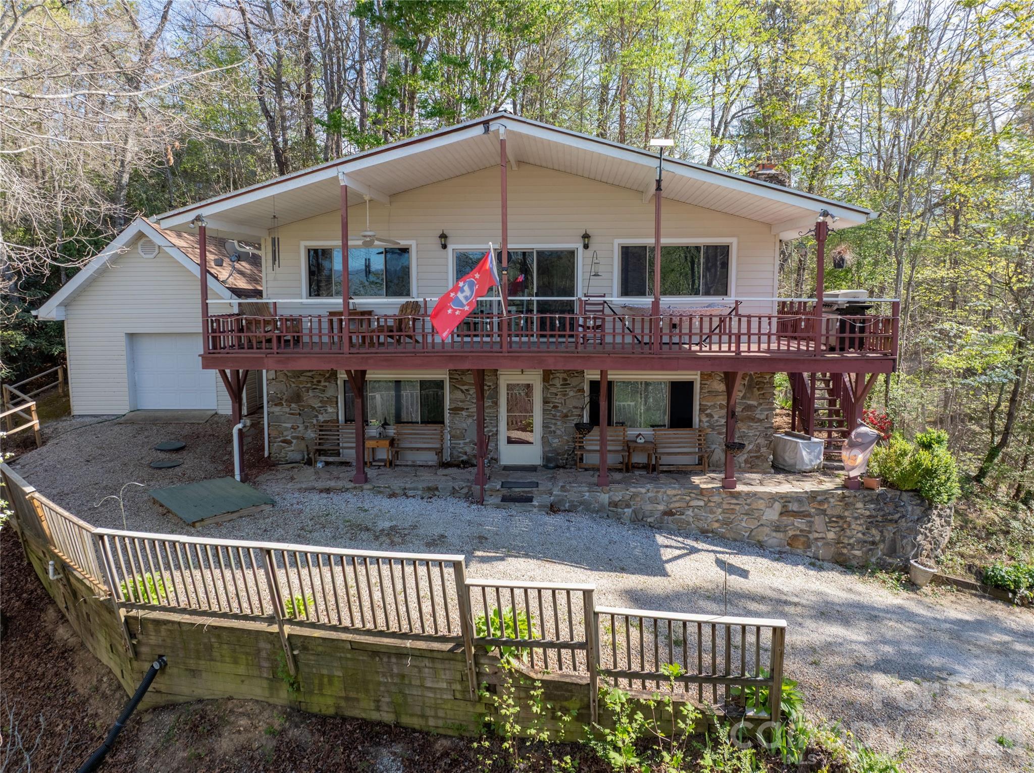 344 Pine Ridge Trail Almond, NC 28702 - Photo 3 of 36 a view of a white house with a deck and furniture