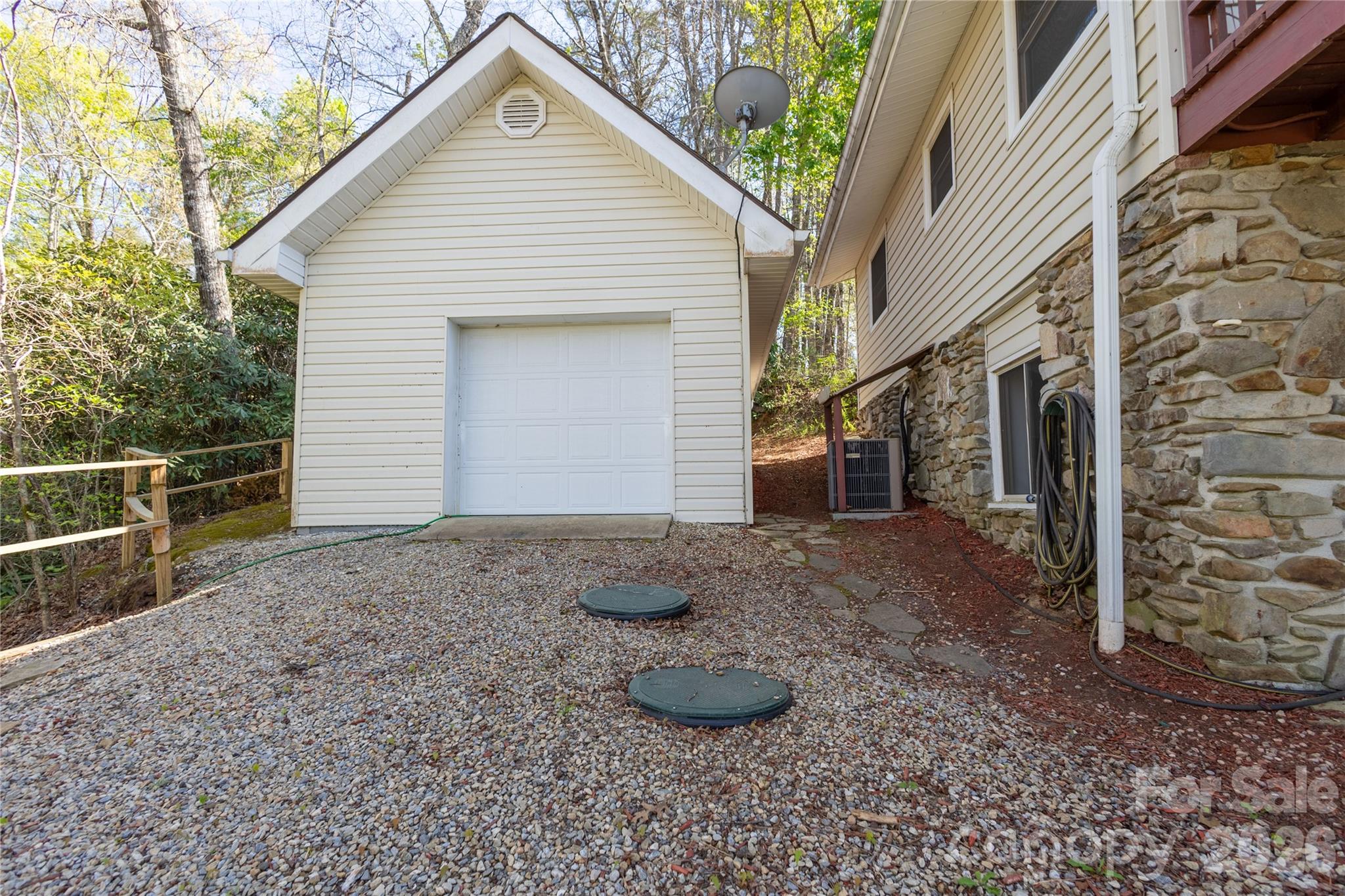 344 Pine Ridge Trail Almond, NC 28702 - Photo 31 of 36 a view of a house with a yard and garage