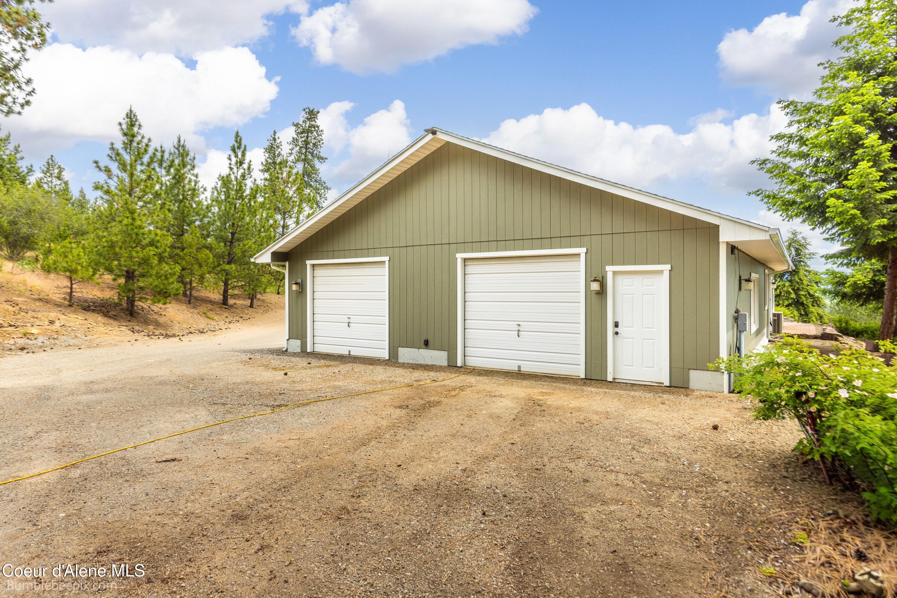 10324 North Payment Peak Road Post Falls, ID 83854 - Photo 86 of 98 ADU garage door right, shop Left