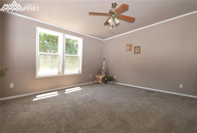 27055 Handle Road Calhan, CO 80808 - Photo 9 of 25 The large master bedroom with more natural light coming through the windows.