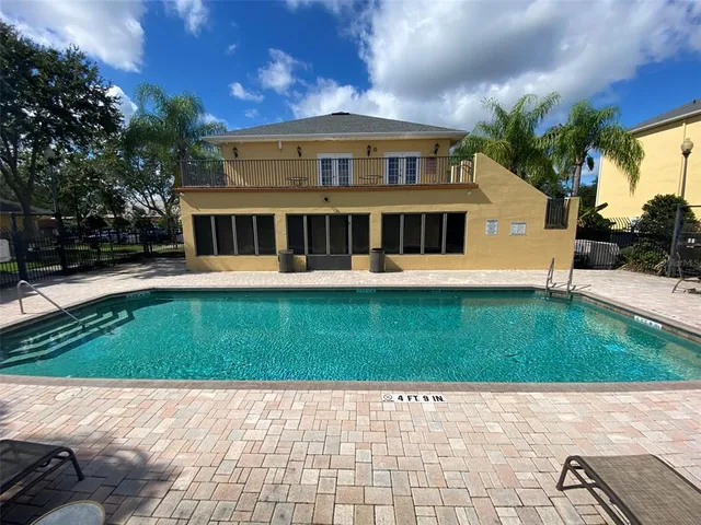 a view of a park with large trees