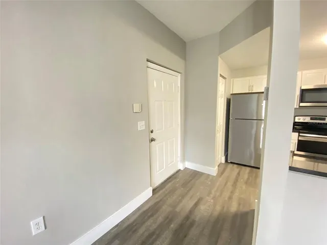 a view of a kitchen with a refrigerator