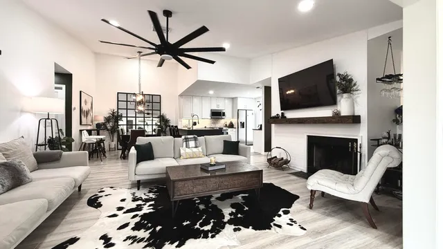 a living room with furniture fireplace and a flat screen tv