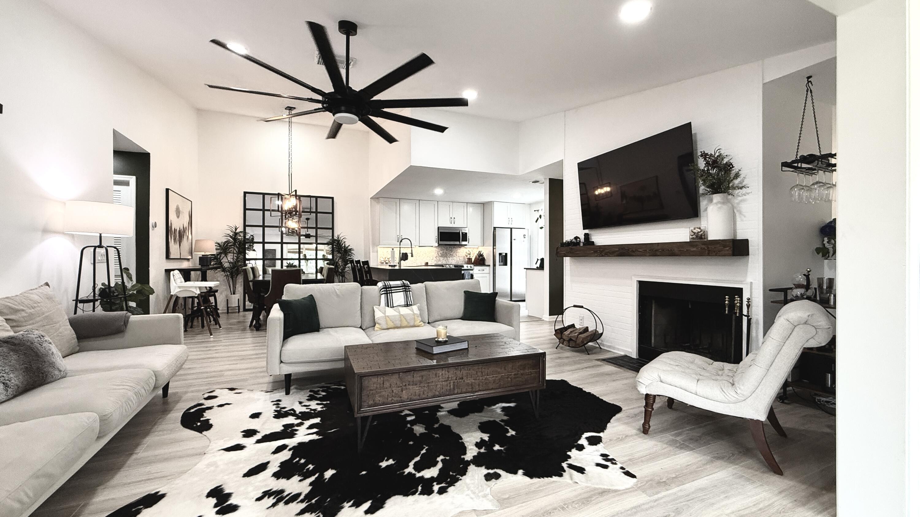 a living room with furniture fireplace and a flat screen tv