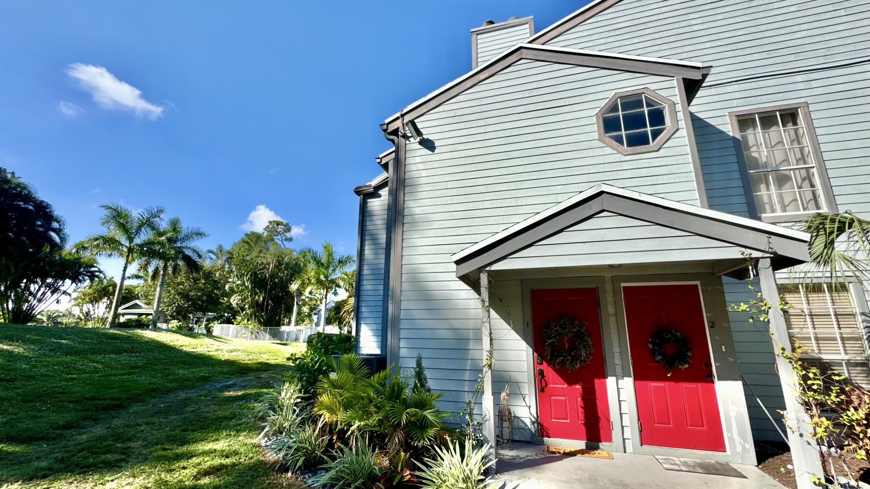 5016 Heatherhill Lane, Unit 10 Boca Raton, FL 33486 - Photo 12 of 12 a view of a house with a yard