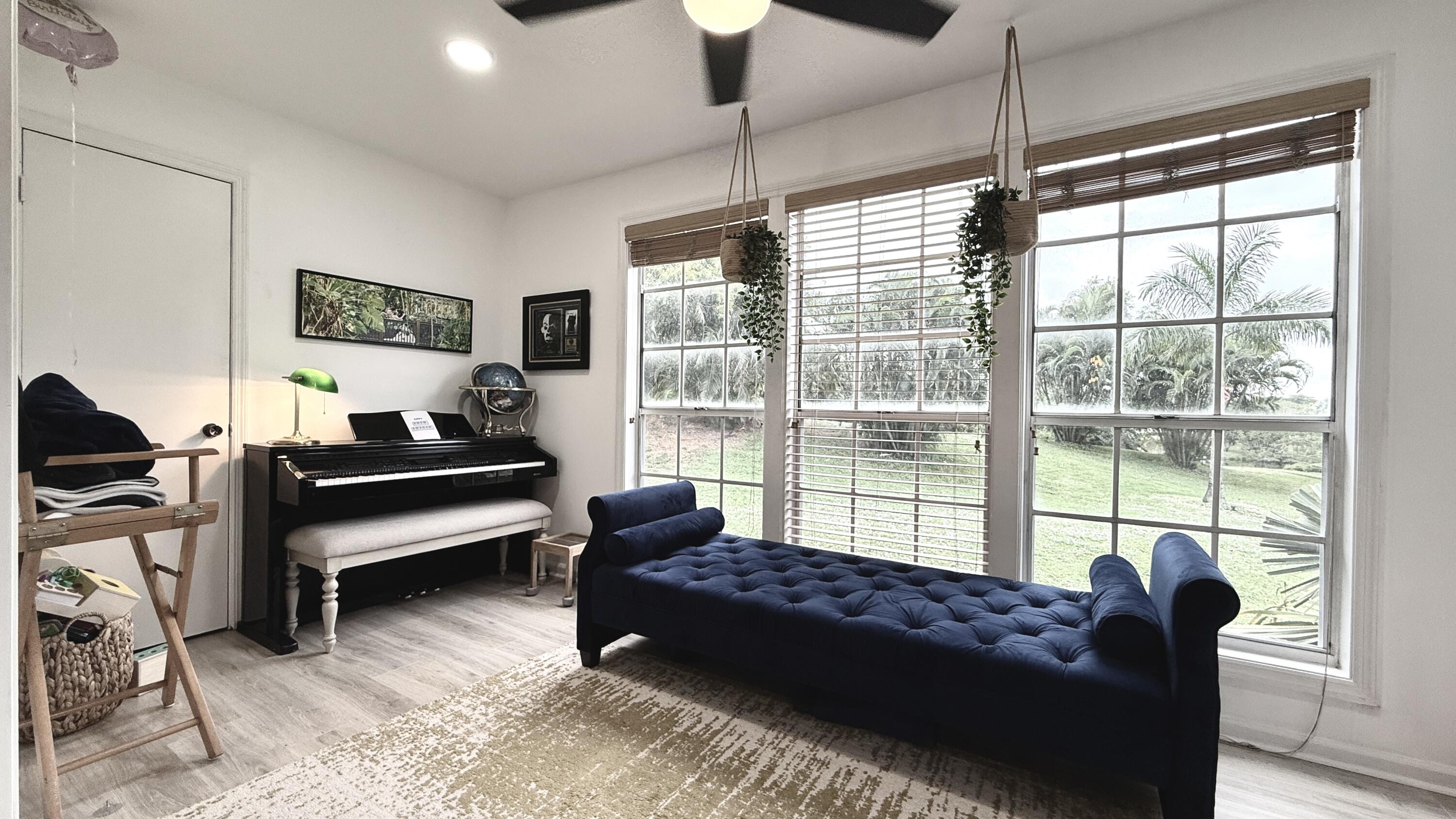 5016 Heatherhill Lane, Unit 10 Boca Raton, FL 33486 - Photo 5 of 12 a living room with furniture and a floor to ceiling window