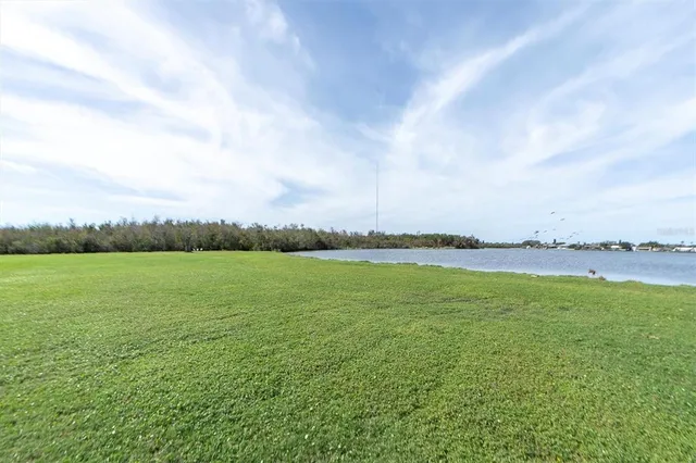 a view of a lake and a yard