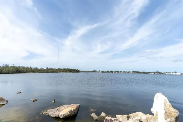 a view of a lake with mountain view in back