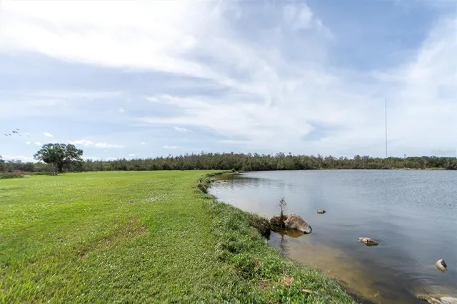 a view of a lake with a city