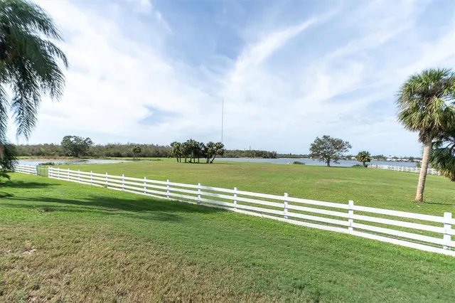 a view of a golf course with a lake
